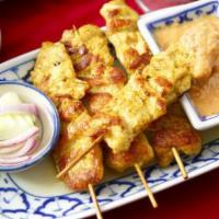 Chicken Satay · Tender strips of marinated chicken served with a homemade peanut sauce.