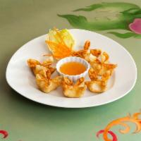 Crab Rangoon · Crispy fried parcels stuffed with cream cheese, carrots, spring onions, and crab sticks.
Ser...