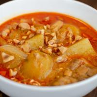 Massaman Curry · Southern Thailand dish with coconut milk, potatoes, sweet potatoes, carrots and onions, topp...