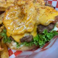 Bayou Burger · Fresh Angus ground beef topped with Cajun cheese sauce with sauteed shrimp and crawfish tail...