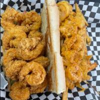 Shrimp Po Boy · Juicy fried shrimp dressed with lettuce, tomatoes, pickles, and mayo.