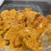 Seafood Nachos · Cajun cheese sauce with sauteed shrimp and crawfish tails.