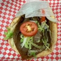 Lamb Gyro Sandwich · Comes with lettuce, tomatoes, onions and cucumber sauce on pita.