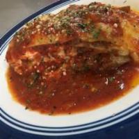 Lasagna · home made comes with meat, Mozzarella and Ricotta Cheese, Served with bread and salad.