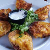 Potato Skins  · Crispy Potato Skins with your choice of Bacon or Veggie fillings.