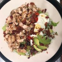 Cobb Salad · Grilled chicken breast, blue cheese, bacon, avocado, kalamata olives  and hard boiled egg ov...