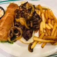 Sliced Sirloin Steak Sandwich · Eight-ounce steak sliced and served over French bread with sauteed onions and mushrooms.