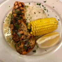 Grilled Atlantic Salmon · In a lemon butter sauce. Served with a vegetables and one side of choice.