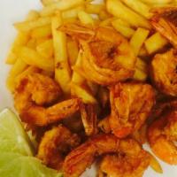 Camerones Grandes/ Jumbo Shrimp · Jumbo shrimp. Served with fried green plantains or french fries or fried rice. 