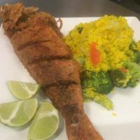 Pescado Colorado/ Red Snapper · Red snapper. Served with fried green plantains or french fries or fried rice. 