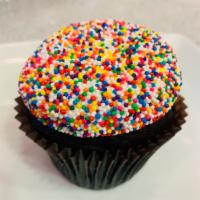 Birthday Cake on Chocolate Cake · A chocolate cake with signature white buttercream dipped in rainbow colored sprinkles. 