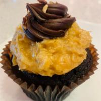 German Chocolate  · A chocolate cake with our signature German (coconut and pecan) frosting, fudge swirl, & peca...