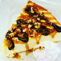 Slice of Classic Cheesecake  · A slice of New York Style cheesecake with your choice of drizzle(s).