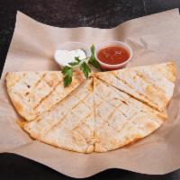 Homemade Chicken Quesadillas · Pepper jack, cheddar cheese, salsa, grilled tortilla, with grilled chicken.