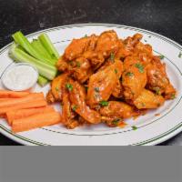 Large Chicken Wings · 20 wings tossed in Buffalo sauce.