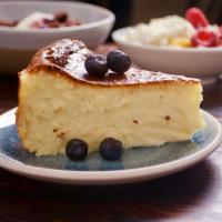 Basque Cheesecake · with fermented blackberry sauce