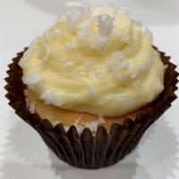 Coconut Cupcake · A vanilla cake topped with our signature coconut cream cheese and coconut flakes.