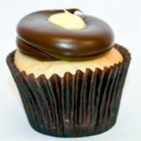 Boston Cream Cupcake · Bavarian cream filled vanilla cake with a smooth bavarian cream fudge frosting and dollop of...