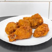 Wings · Cooked wing of a chicken coated in sauce or seasoning.