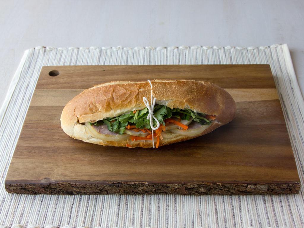 Classic Banh Mi  · All sandwiches come with pate, mayo, butter, cucumber, pickled carrots & daikon radish, and cilantro served on a toasted French baguette.
