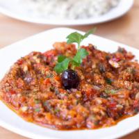 Ezme · A mixture of minced tomatoes, cucumber, hot spices, peppers, garlic, onions, walnut olive oi...