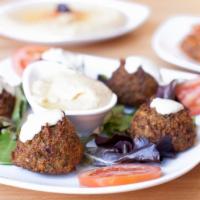 Falafel · 5 pieces. Deep-fried chickpeas and vegetables, blended with Middle Eastern spices served wit...