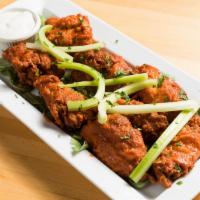 8 Buffalo Wings · Served with blue cheese and celery.