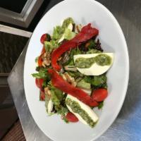 Fresh Mozzarella Salad · Fresh mozzarella, roasted pepper and tomatoes, walnut, pesto sauce and mix green salad.