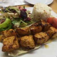 Chicken Shish Kebab · Tender chunks of chicken marinated with chef's own blend and herbs. Served with salad and ri...
