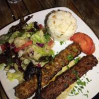 Chicken Adana Kebab · Ground chicken flavored with red bell peppers, parsley and grilled on skewers. Served with s...