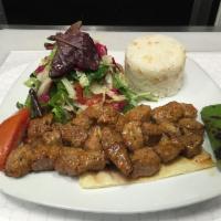 Diced Shish Kebab · Small cubes of baby lamb marinated in chef's special sauce and grilled on skewers. Served wi...