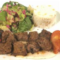 Beef Shish Kabab · Cubes of beef marinated in chef's special sauce and grilled on skewers. Served with rice and...