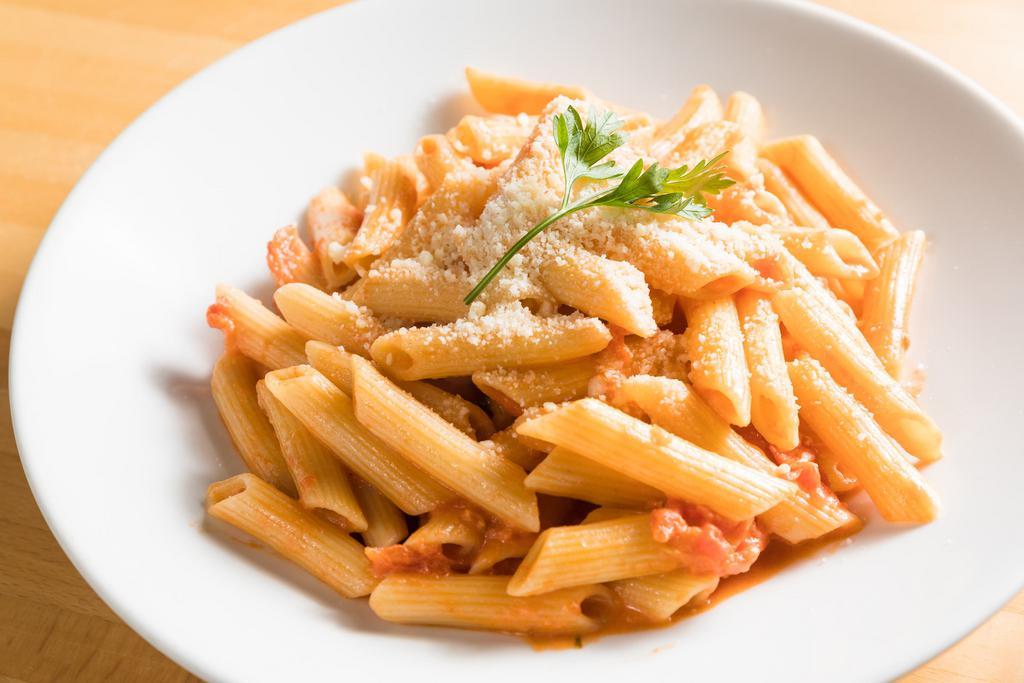 Penna Pasta · Penna pasta topped with Parmesan cheese and parsley.