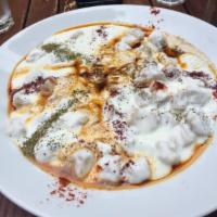 Manti · Light dough stuffed with seasoned lamb and onions. Steamed to perfection and served with sea...