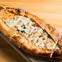 Karisik Pide( Mixed Pide ) · Mixed pide. A thick dough crust stuffed with seasoned ground lamb, kashar cheese, soujouk an...
