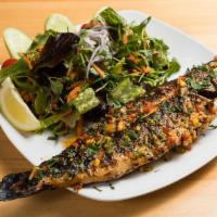 Char-Grilled Branzini · Exotic, tender and delicious white meat, served whole and char-grilled with mixed green salad.