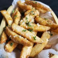 Parmesan Truffle Fries · Crispy fries tossed with parm cheese fresh parsley and whit truffle oil.