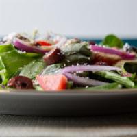 Greek Salad · Roma tomatoes, onions, Kalamata olives, feta, and house-made Greek dressing. Add chicken for...