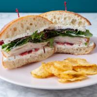 Turkey Cranberry Sandwich · Deli turkey, herbed cream cheese, cranberry sauce and mixed greens on whole grain or ciabatta.