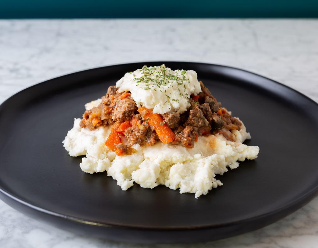 Shepherd's Pie · Our take on this cozy classic: ground beef, celery, mushrooms and carrots with a mashed potato top layer.