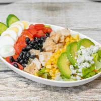 Cobb Salad · Grilled chicken, avocado, cucumbers, tomatoes, corn, eggs, bacon, lettuce & blue cheese crum...