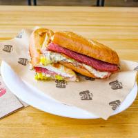 Italiano Sub · Ham, salami, Provolone cheese, banana peppers, tomatoes, red onions, and sub dressing.