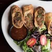 Pulled Pork Egg Roll · Stuffed With House Smoked Pork and Veggies.