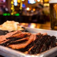 Brisket Platter · House-Rubbed, Bourbon-Infused, Smoked Low 'N' Slow 16 Hours, Served With 2 sides.