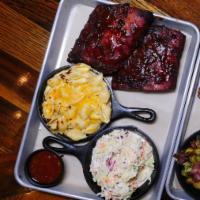Baby Back Rib Platter · 8 Rack. House-Rubbed, Smoked, Mopped and Grilled, Served With Any 2 Sides.