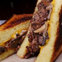 Short Rib Grilled Cheese · Served With American Cheese, Braised Short Rib, Sauteed Mushrooms, and Onions.