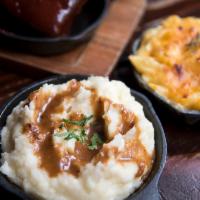 Mashed Potatoes · Garlic Whipped Potatoes With A Side of Gravy. 