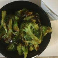 Sauteed Broccoli in brown sauce 净芥兰 · Served with white rice.