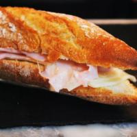 Ham and Cheese Croissant Sandwich · Ham and cheese on a warm croissant.