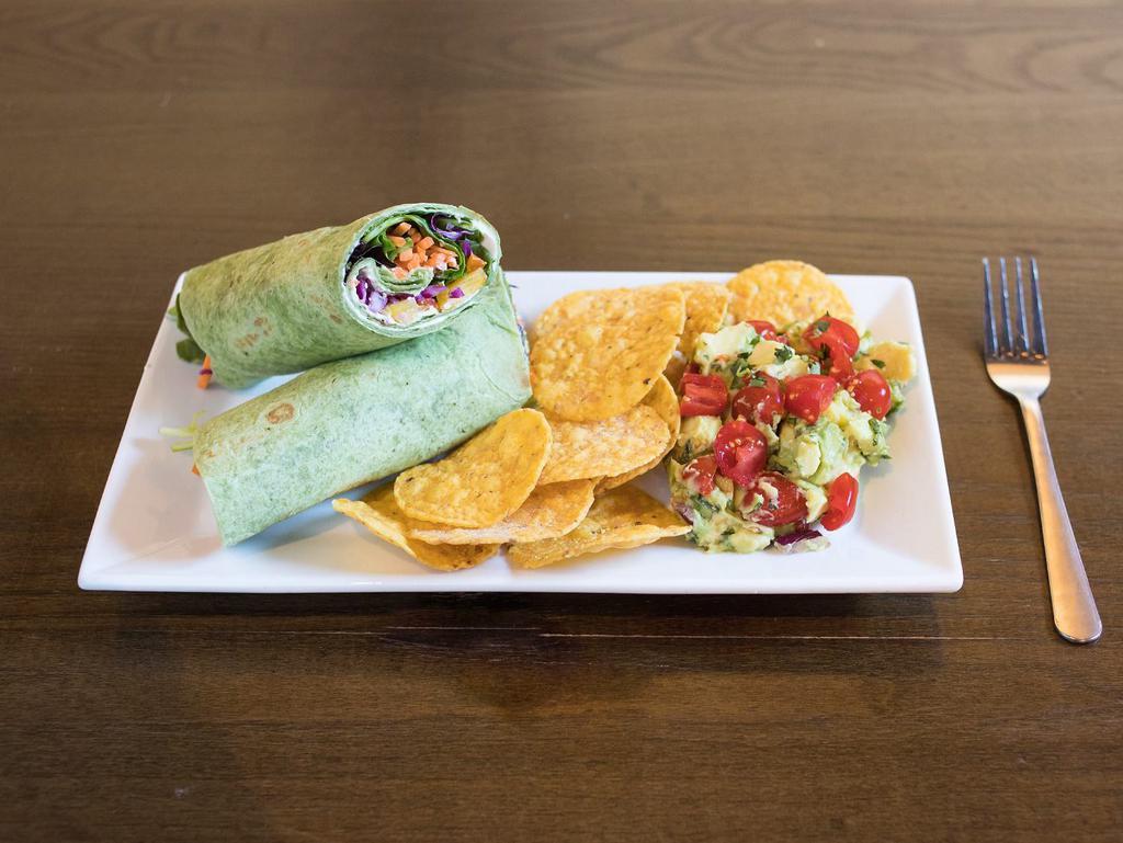 Veggie Wrap · Spinach wrap filled with sliced bell peppers, mixed greens, red cabbage, shredded carrots and ranch cream cheese spread.